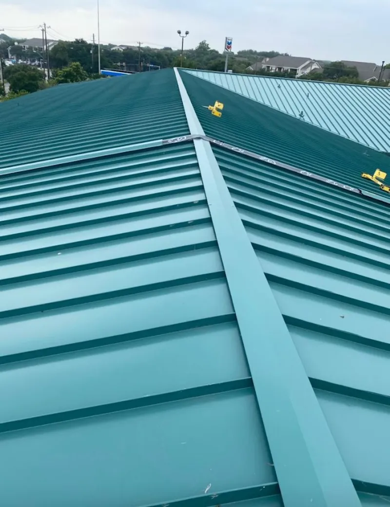 Green commercial metal roof ridge and valley for Metal Roof Repair in Missouri City